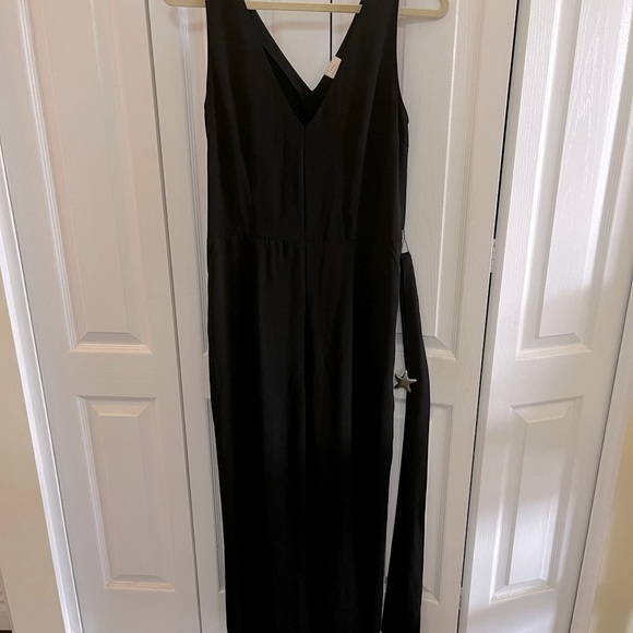a new day Pants - EUC Sz M. A New Day black jumper with belt and side pockets. Wide leg. V-neck